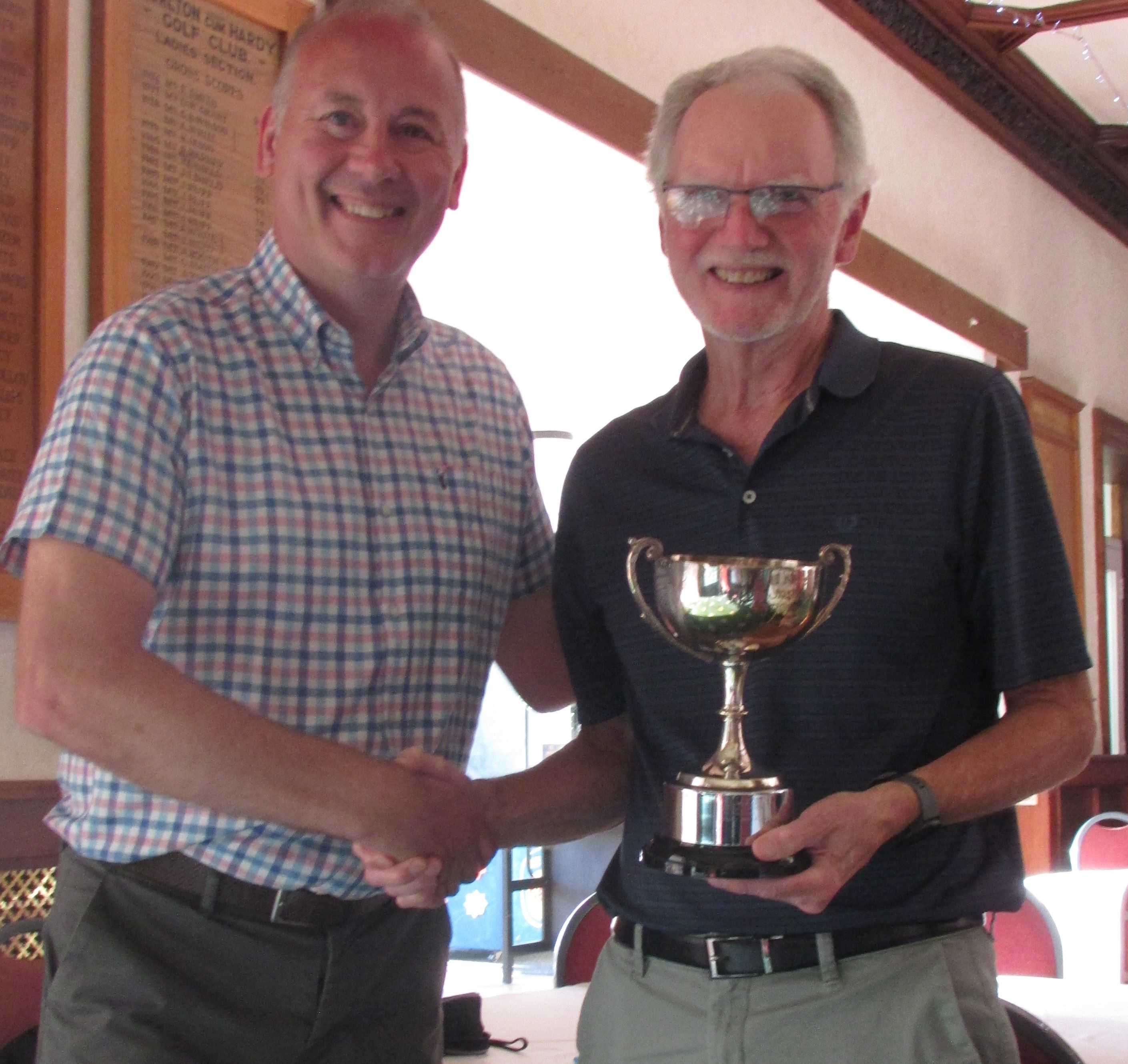 Winner awaiting photo